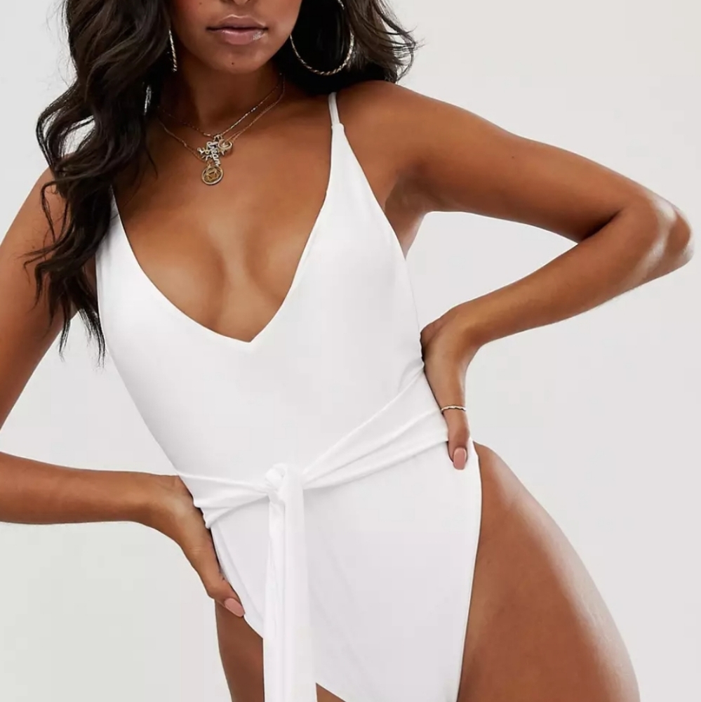ASOS DESIGN skinny strap deep plunge tie front swimsuit in shiny white